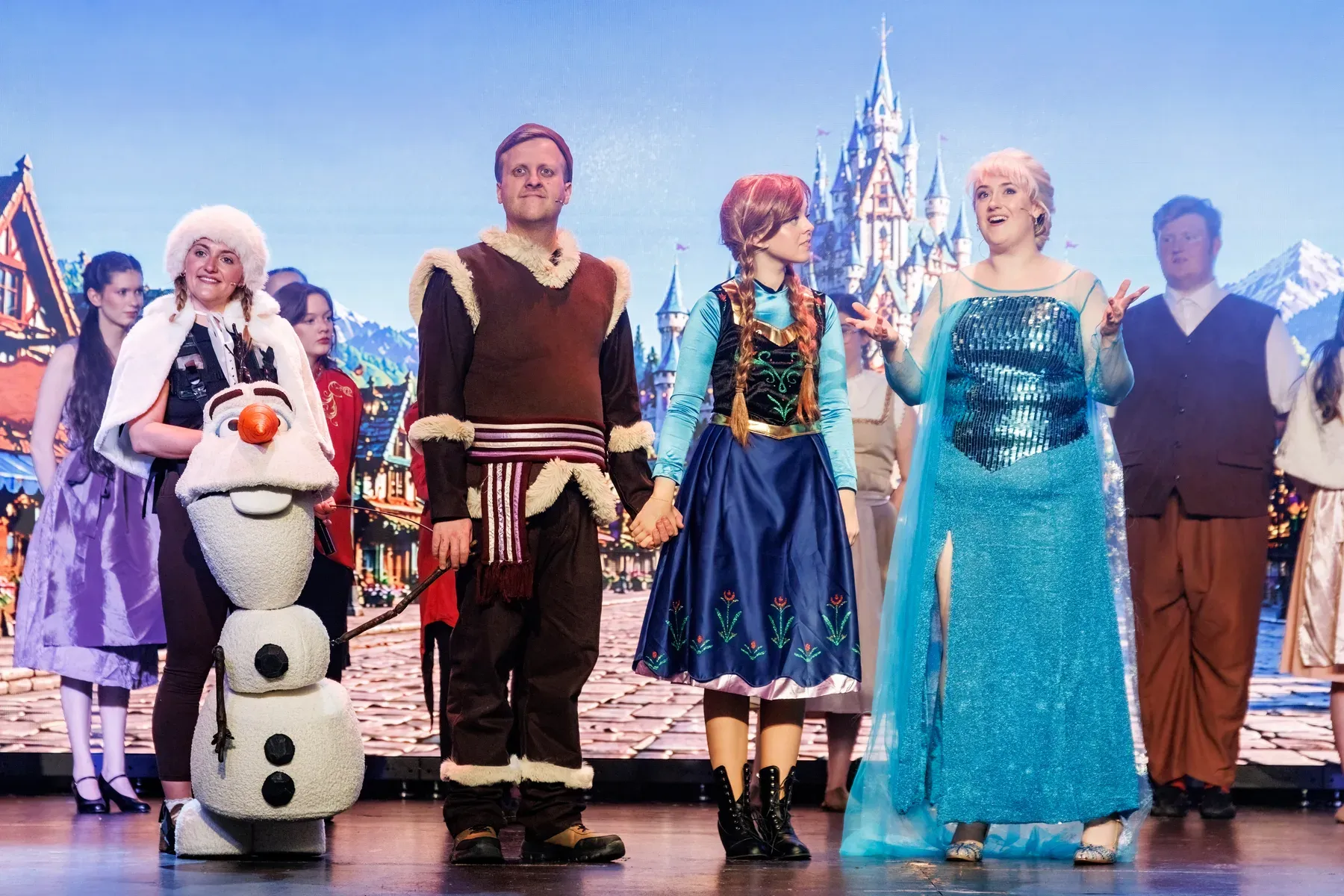 STAMP performers appearing together on stage in the 2026 production of Frozen